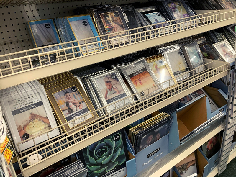 what to buy at the dollar store - frames on a shelf